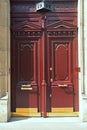 Brown door and brass handles Royalty Free Stock Photo