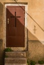 Brown door with a cross Royalty Free Stock Photo