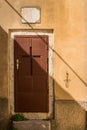 Brown door with a cross Royalty Free Stock Photo