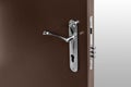 Brown door with metallic handle