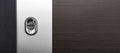 Brown door with a modern door lock in a silver insert with a clean space for text. Copy space