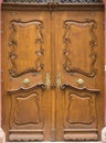 vintage brown door with carvings and ornament keyhole Royalty Free Stock Photo