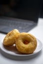 Brown Doughnut Potatoes, with blurry laptop