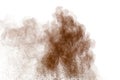 Brown dust exploding cloud.Brown particles splattered on white background Royalty Free Stock Photo