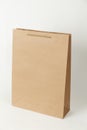 Brown ecological paper bag on white background. Store packaging Royalty Free Stock Photo