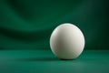 A brown egg against green is painted by fluid light in a long exposure still life Royalty Free Stock Photo