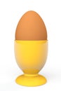 Brown egg in yellow eggcup Royalty Free Stock Photo