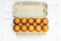 Brown eggs in a cardboard box. Fresh organic chicken eggs in carton or egg container with copy space Close-up view of Royalty Free Stock Photo