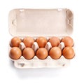 Brown eggs in a carton box on white Royalty Free Stock Photo