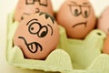 Brown eggs with funny faces Royalty Free Stock Photo