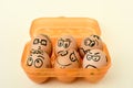 Brown eggs with funny faces Royalty Free Stock Photo