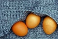 brown eggs on a gray woolen piece of cloth