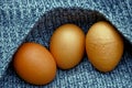 Brown eggs on a gray woolen piece of cloth