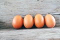 Fresh farm eggs on a wooden rustic background. Royalty Free Stock Photo