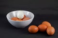 brown eggs in white bolw