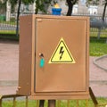 Brown electrical cabinet with Caution, high voltage sign Royalty Free Stock Photo