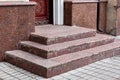 Brown entrance door on a stone threshold. Royalty Free Stock Photo