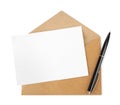 Brown envelope with blank letter and pen on white background, top view Royalty Free Stock Photo