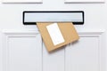 Brown envelope in a front door letterbox Royalty Free Stock Photo