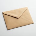 A brown envelope placed on a white surface. The envelope has a triangular flap, Royalty Free Stock Photo