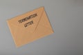 Brown envelope written with TERMINATION LETTER. Unfair dismissal concept