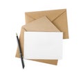 Brown envelopes, blank letter and pen isolated on white, top view Royalty Free Stock Photo