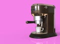 A brown espresso coffee machine on pink background with space for text.