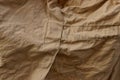 Brown fabric texture from a piece of crumpled old clothes Royalty Free Stock Photo