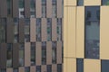 Brown facade of a modern building, office or residential building. red brick, lots of glass, skyscraper. Windows of different Royalty Free Stock Photo