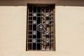 Brown facade of an old building with windows and shutters, iron wrought iron grating Royalty Free Stock Photo