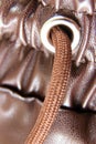 Brown faux leather elasticated waist drawstring jogger trousers close-up