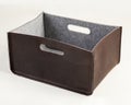 Brown faux leather storage box with felt lining and handles