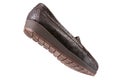 Brown female shoes made of reptile skin, low-soled with a tread, as if walking, on a white background Royalty Free Stock Photo