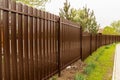 brown fence. ventilated fencing for a farm or country house.