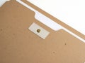 Brown file folder with white label and brass fastener Royalty Free Stock Photo