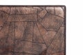 Brown fine polygon-textured leather. Close-up edge isolated at white background Royalty Free Stock Photo