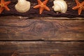 Brown fishing net, starfish and shell on wooden background Royalty Free Stock Photo