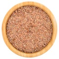 Brown flax seeds in wooden bowl isolated. Royalty Free Stock Photo