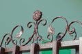 Brown forged metal pattern of iron rods on the wall of the fence Royalty Free Stock Photo