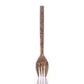 Brown fork made from palm wood. Studio shot isolated on white ba Royalty Free Stock Photo