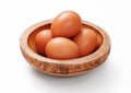 Brown fresh raw eggs in wooden bowl plate on white background Royalty Free Stock Photo