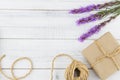 Brown gift box and rope decorated with violet liatris flowers Royalty Free Stock Photo