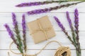 Brown gift box and rope decorated with violet liatris flowers Royalty Free Stock Photo