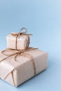 Brown gift box tied with white ribbon on clear background, copy space, eco-friendly present concept Royalty Free Stock Photo