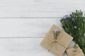 Brown gift boxes with purple cutter flowers Royalty Free Stock Photo