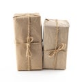 Brown giftbox wrapped in kraft paper, the package is standing upright on an isolated background