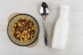 Brown bowl with breakfast cereals in form stars, spoon, yogurt Royalty Free Stock Photo