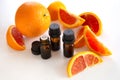 Essential oil bottles with orange wedges