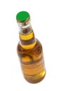 Brown glass lager beer bottle with black cap isolated on a white background