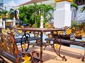 brown gold iron carving bench with arabic architecture in madiun indonesia park, sunny weather